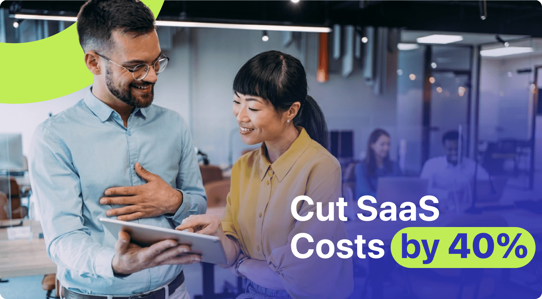 Two smiling colleagues review data on a tablet in an office. Text: Cut SaaS Costs by 40%.